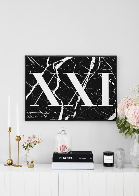 XXI