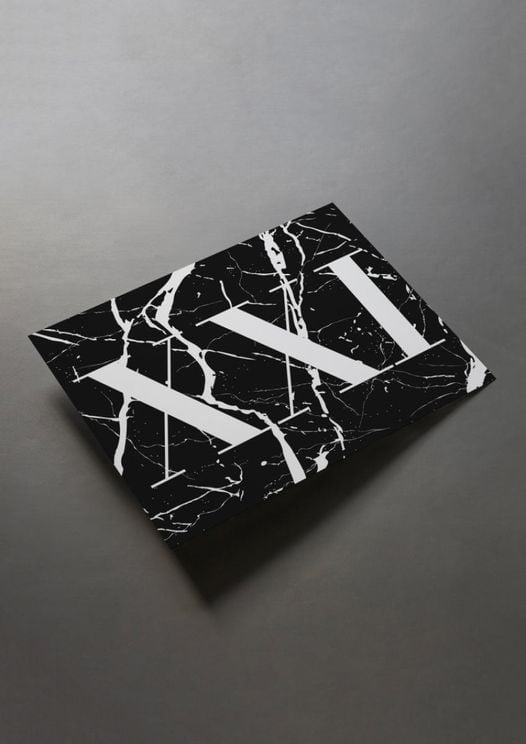 XXI